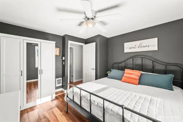 Cozy bedroom includes new fan/lighting fixture, floors, and freshly painted.