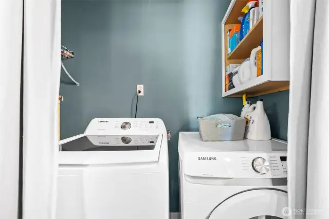 Launry is tucked away in hallway and water heater just to left of washer (not shown.)