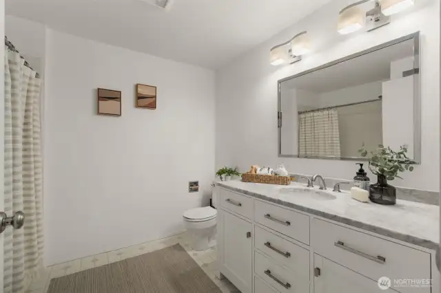 Full bathroom with newer vanity