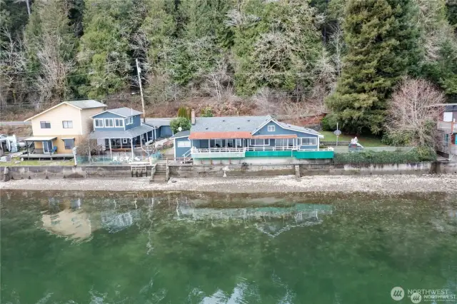 Both blue homes shown are included in sale.
