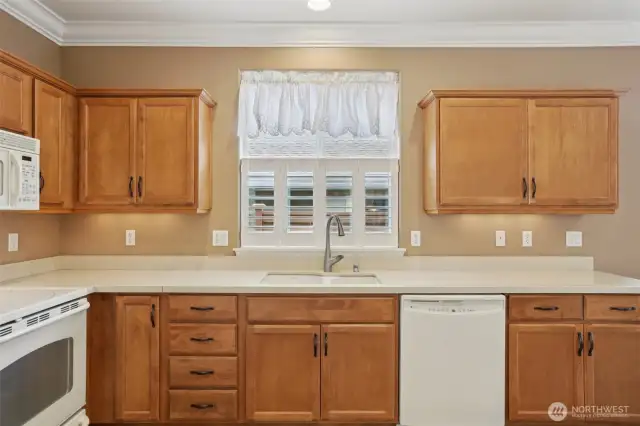 Plantation shutters in this kitchen window and the spare bedroom.