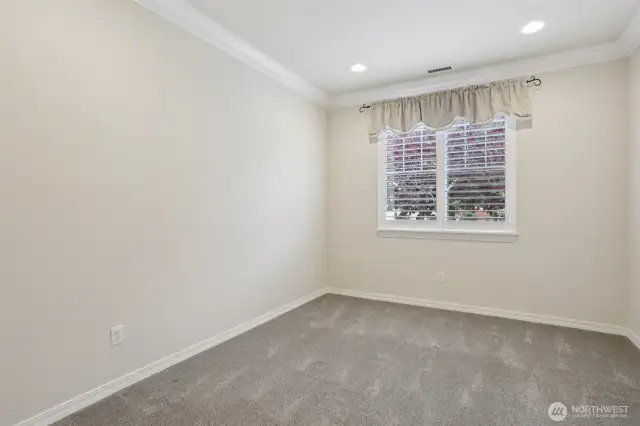 Spare bedroom with walk-in closet