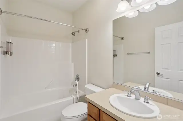 Spare bathroom has a full bathroom with a tub. Set up with a handle if someone needed help getting out of the tub.
