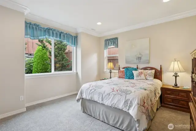 Primary bedroom Suite includes walk in closet and tile shower and floors. Furniture may stay if buyer wishes.