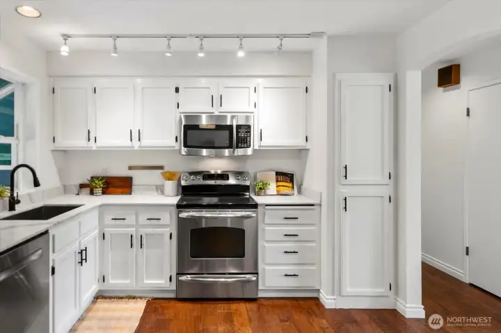 Kitchen with new quartz counters and fresh paint