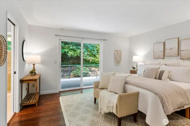 Primary suite with sliding doors to the private back deck