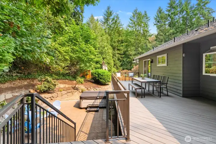 Steps down to the patio with hot tub that stays