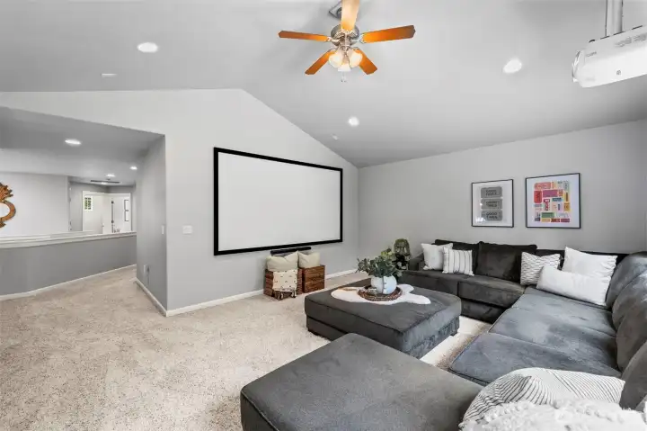 Enjoy some fall football in this large bonus room, screen and projector convey!