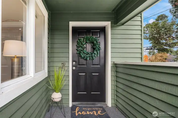 Covered front porch welcomes you with new flooring