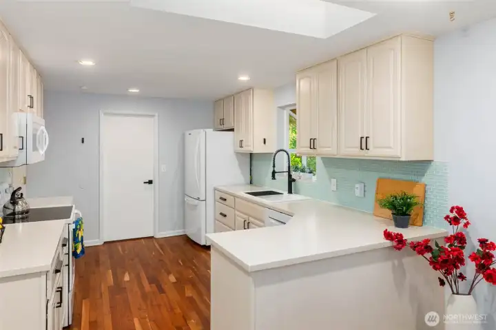 Kichen leads to Laundry and Garage