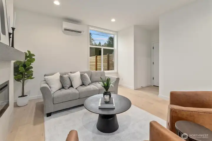 Hallway to the right is entry from the garage and powder room