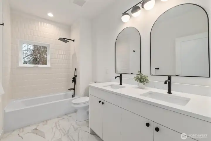 Hall bathroom with double sinks