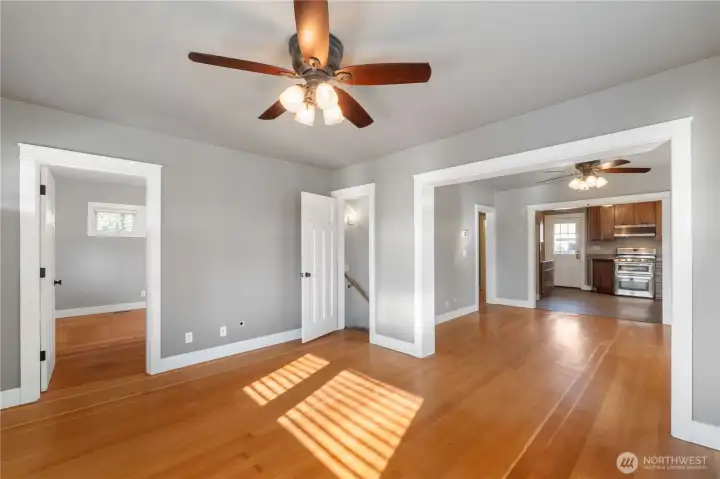 Overall view from the living room.  Bedroom on the left, stairs to basement rec room at center and dining and kitchen on the right.