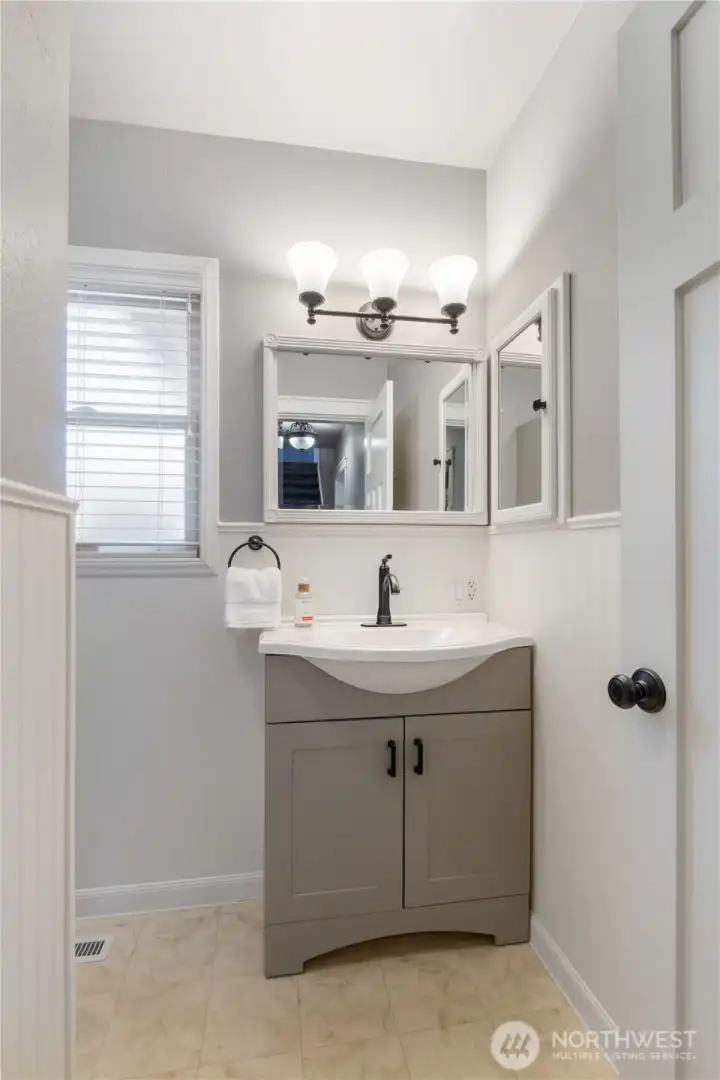 Hallway bathroom on main floor with new vanity.