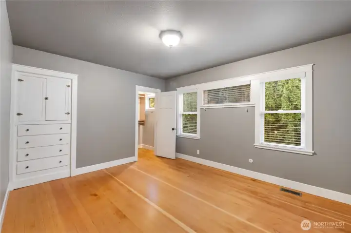 Primary bedroom with built-ins, walk in closet and ensuite bath.