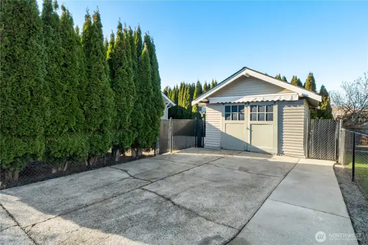 Detached garage with awning for working on a project in the rain.  Plenty of driveway parking here.
