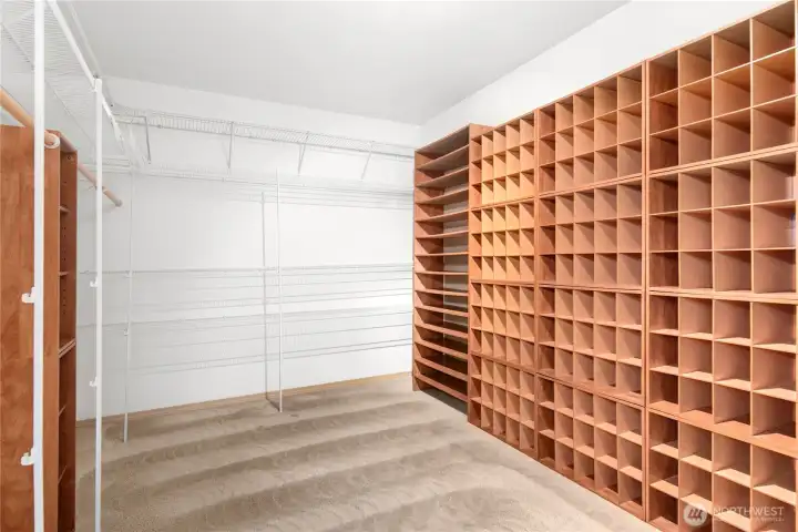 Large owners suite with fireplace, spacious bath and super size closet with built ins.