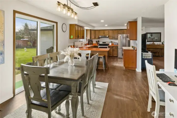 Here is a view of dining room and kitchen. Just off the living room w/ easy access.