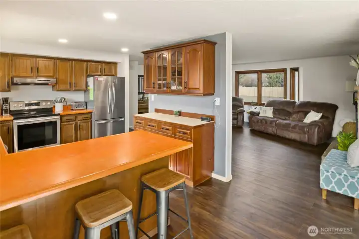 You can see this is a large very functional kitchen with access to living room and dining room. There are new SS appliances that are included.