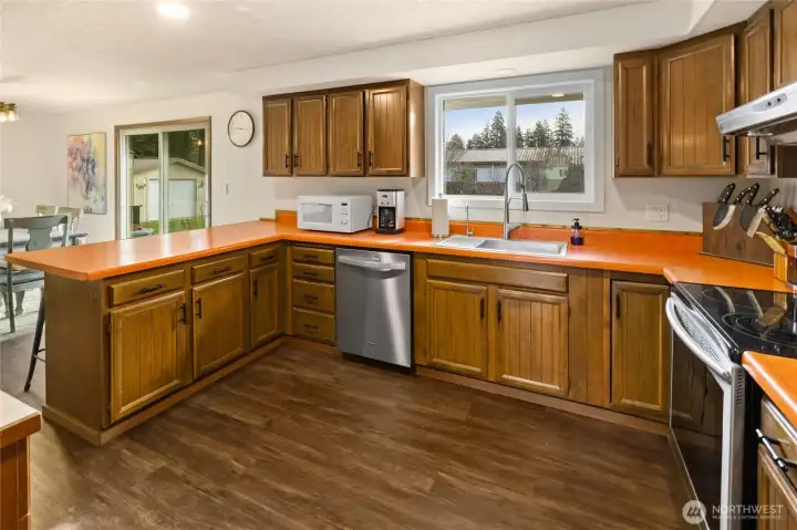 Another view of this great kitchen area. The window above the sink allows nice view to the huge fenced back yard. Easy way to keep a look out for kiddos or dogs running around outside.