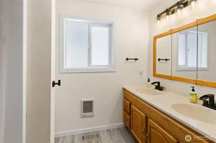 Recently updated primary bathroom with 2 basins.