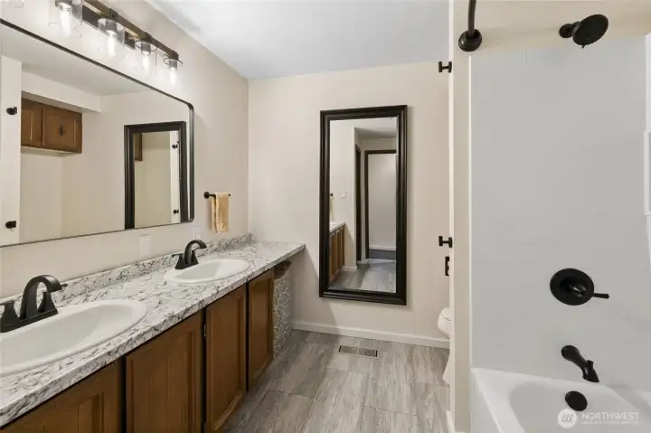 View of the hallway bathroom that has also been updated. New everything here!