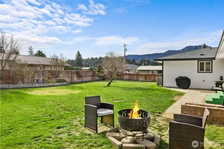There is a large concrete patio as well as a fire pit area to enjoy.