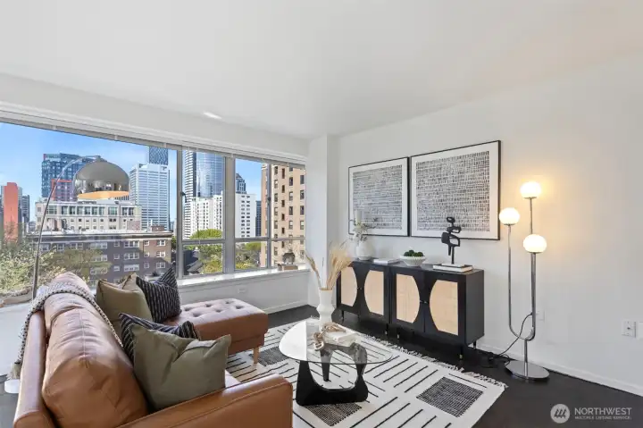 Classic parquet flooring pairs with a refined modern aesthetic, adding a warm touch.