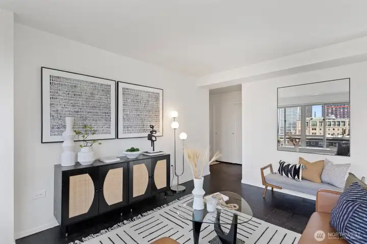 Freshly painted, cleaned and updated, this SW corner unit is light and bright and so central to everything.