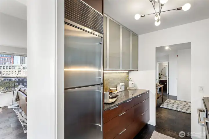 Beautiful subway backsplash, stainless farmers sink with pull-down faucet, this kitchen is a dream come true. New Sputnik chandelier with milky frosted glass globes.
