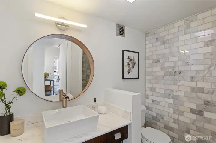 Bathroom 2 - A vessel sink, modern fixtures and a marble shower makes this bathroom feel spa-like!