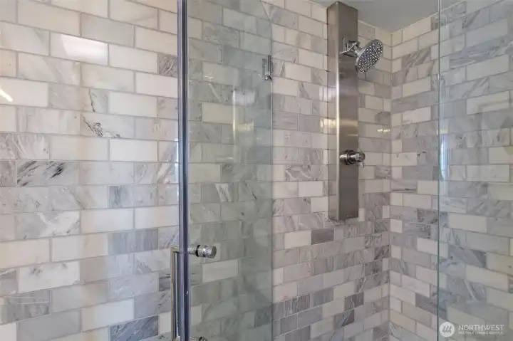 Spa-inspired bathrooms showcase marble finishes and high-end fixtures.