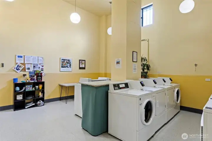 Shared Laundry Room - Featuring machines with web access. A great room to hang out and work or fold laundry at the table, or grab a favorite book from the little library!