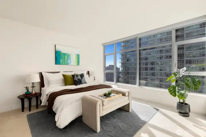 Primary suite complete with water views.