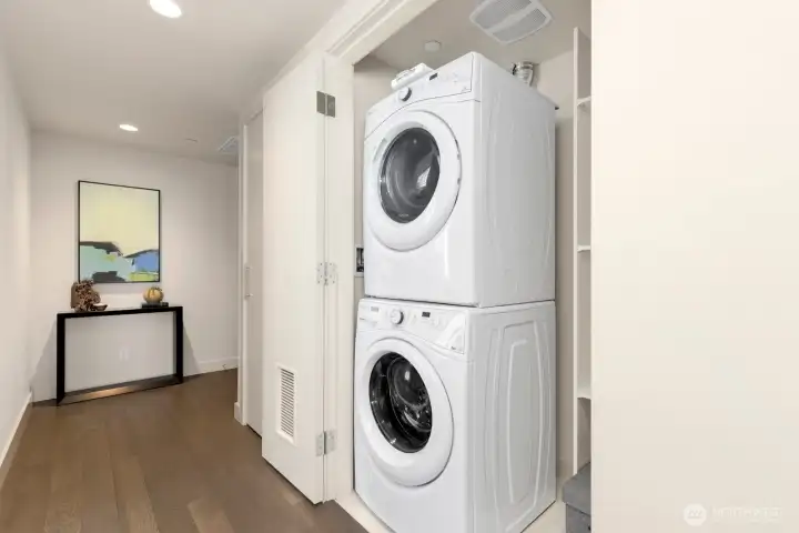 Full size laundry with additional storage.