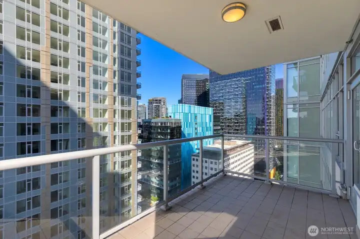 Spacious balcony with city views.
