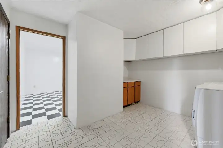 BIG laundry room with extra cabinets and wash sink