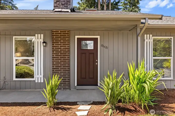 Fresh exterior paint, new concrete exterior entryway.
