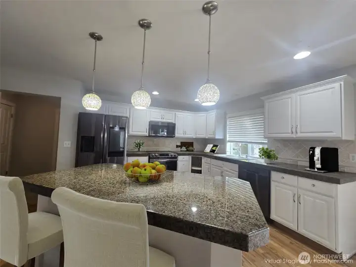 Kitchen (virtually staged). Please see disclosures in the remarks.