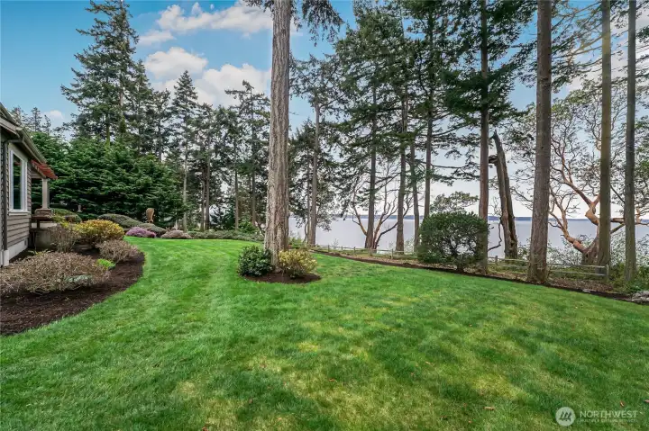 Beautifully manicured grounds allow you to enjoy your waterfront paradise. Beautifully manicured grounds allow you to enjoy your waterfront paradise.