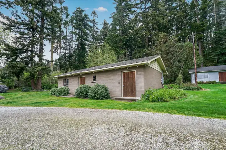 The second outbuilding was designed as a gathering space. It would also make an excellent shop. The second outbuilding was designed as a gathering space. It would also make an excellent shop.