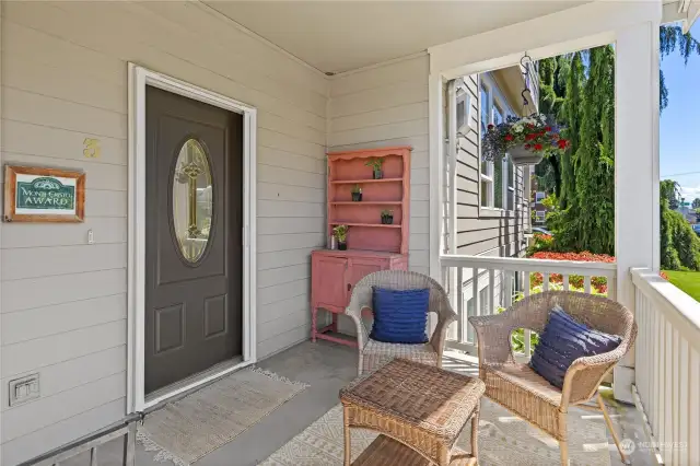 Lovely covered porch has hosted many neighborhood get togethers.  Also, conveniently located, also find a storage closet to stash outdoor accessories.