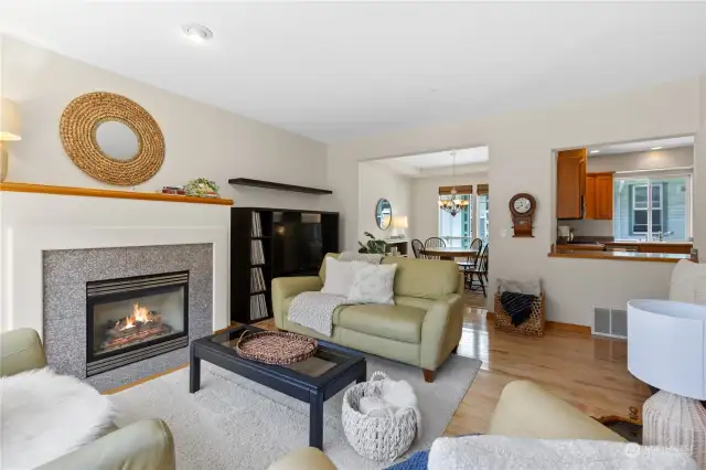Gorgeous gas fireplace and high ceilings create a glamours vibe in the main living space.