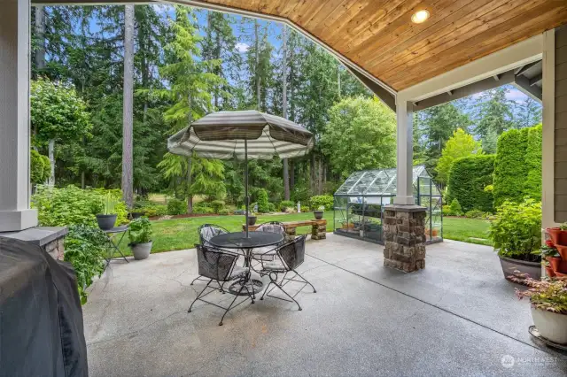 Host gatherings on the covered patio, perfect for outdoor dining and enjoying the serene garden surroundings.