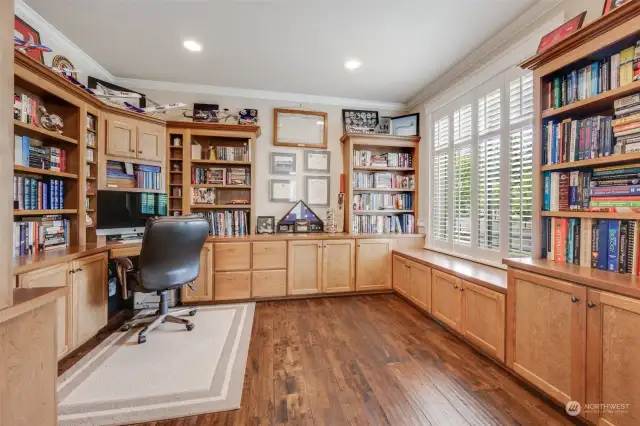 Private office on the main, complete with glass French doors and custom built-in desk/bookshelves.