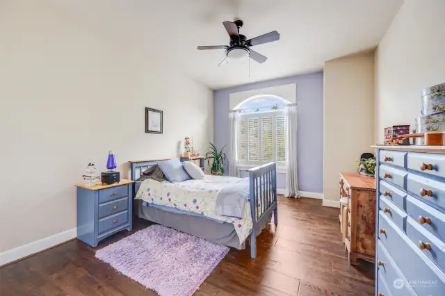 Bright and airy bedroom features large windows, spacious two door closet and hardwood floors.