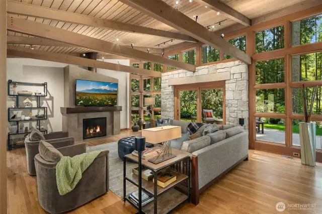 Living room with a gas fireplace and access to the patio