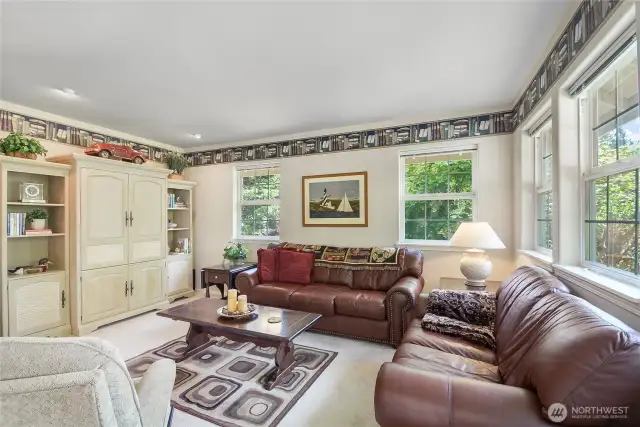 This is such a cozy comfortable Den/tv room which could be a 4th bedroom.