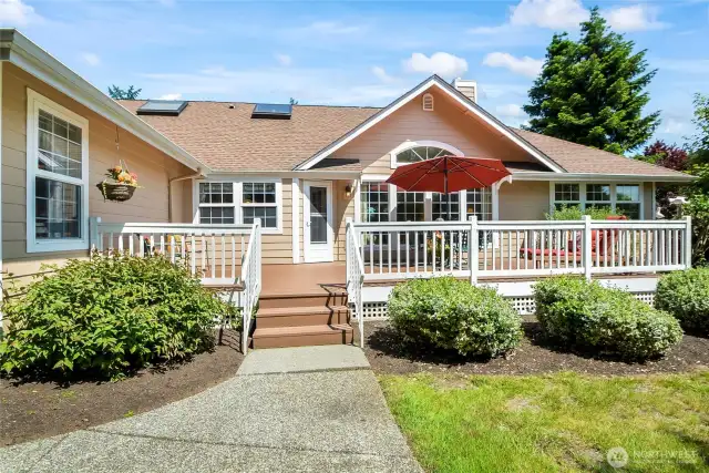 Sidewalks around the entire one side of the home with a nice patio and RV parking on the side of the garage with door going into the garage.
