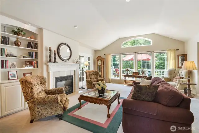 Enjoy the living with beautiful custom built-in book cases and gas fireplace